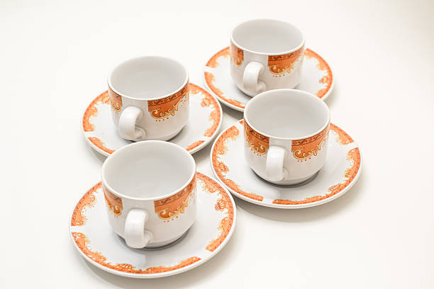 istock Elegant coffee cups with saucers, arranged in a minimalistic, clean composition 2239178613