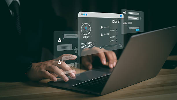 istock Close-up of hands typing on laptop with virtual AI assistant, chatbot, and code interface, representing artificial intelligence, automation, and smart digital support system. 2239179102