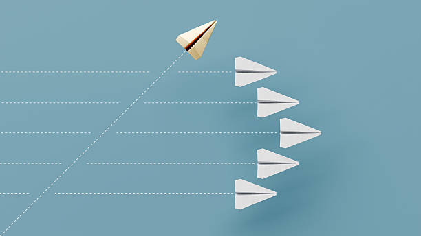 istock One paper plane taking a unique path across formation, standing out, individuality, leadership - 3d render 2239183591