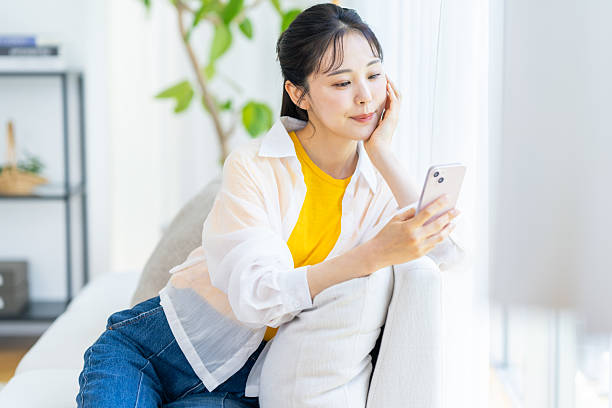 istock A woman operating a smartphone in the room 2239184487