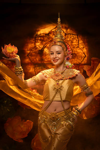 istock A beautiful woman in traditional Thai costume performing a classical dance 2239186428