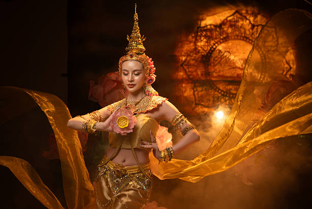 istock A beautiful woman in traditional Thai costume performing a classical dance 2239186441