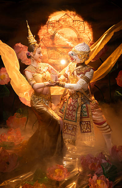 istock Traditional Thai dance performance featuring a graceful female dancer and a masked Khon performer 2239186737