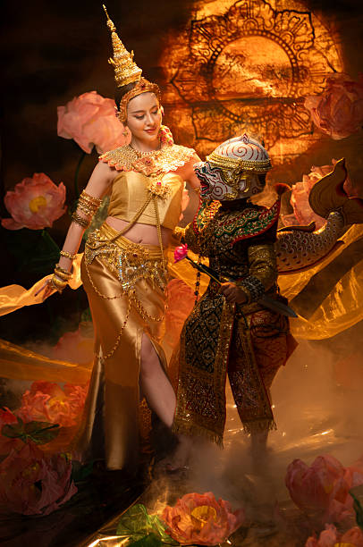 istock Traditional Thai dance performance featuring a graceful female dancer and a masked Khon performer 2239186765