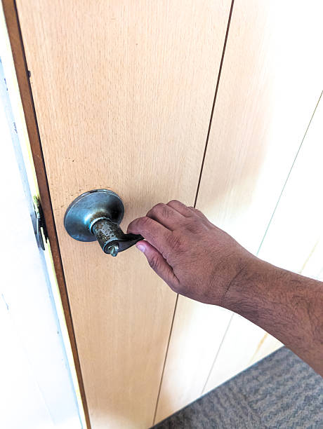 istock A hand gripping a door handle. 2239187961