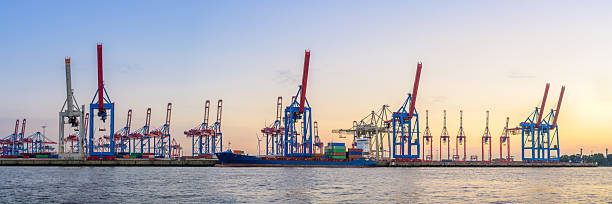 istock Container cranes operate at dusk in Hamburg's bustling terminal port 2239191437