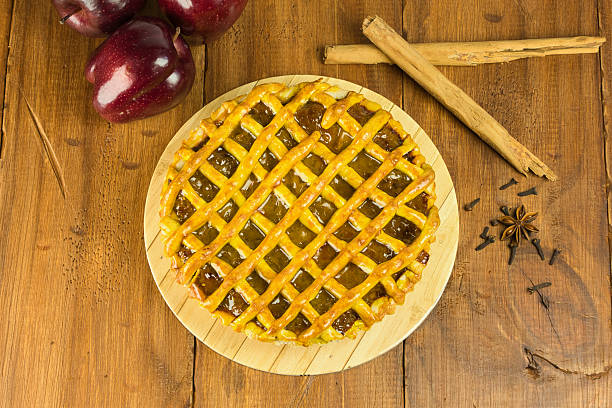 istock Apple pie in close-up on a rustic wooden background. 2239191642