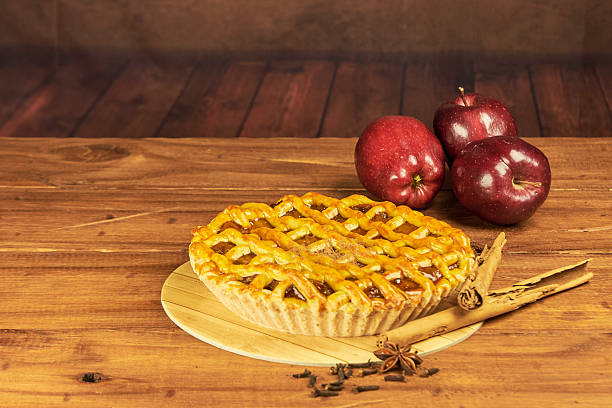 istock Apple pie in close-up on a rustic wooden background. 2239191652