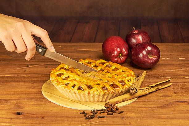 istock Apple pie in close-up on a rustic wooden background. 2239191653
