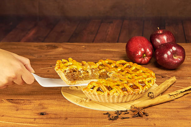 istock Apple pie in close-up on a rustic wooden background. 2239191659