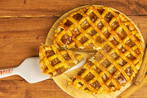 istock Apple pie in close-up on a rustic wooden background. 2239191672