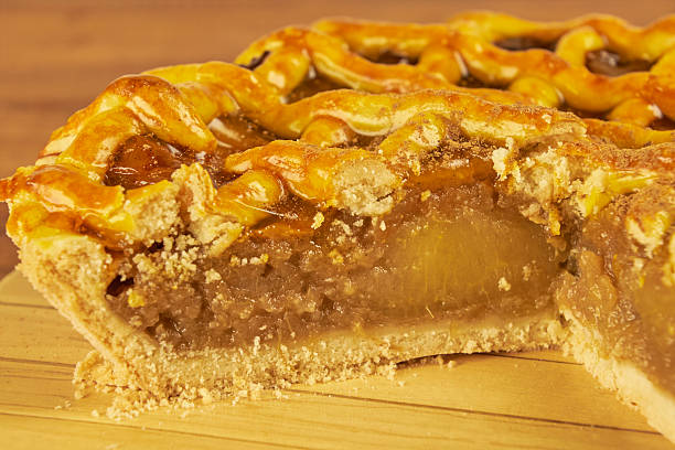 istock Apple pie in close-up on a rustic wooden background. 2239191674