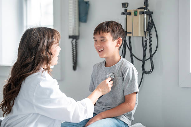 istock Young Patient Completes Checkup With Friendly Female Doctor Using Stethoscope In Bright Clinic 2239193426