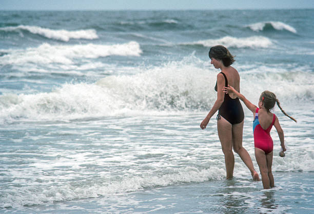 istock Clearwater FL - Mother & Daughter Facing the Surf - 1984 2239195416