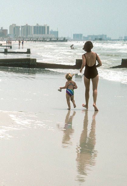 istock Clearwater FL - Mother & Daughter in the Surf with Reflection - 1984 2239195533