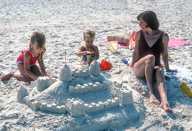 istock Clearwater FL - Mother & Daughters with Sandcastle - 1984 2239195583