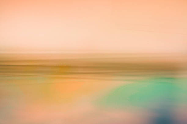 Abstract gradient blur overlay foggy seascape background for conceptual design, presentation, vector backdrop, or wallpaper. Tropical ocean sunrise in soft pastel colors and light texture.