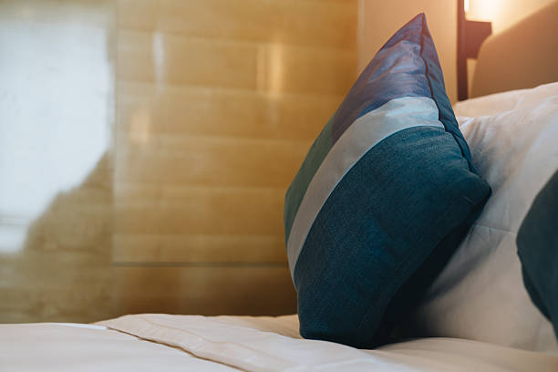 istock pillows in hotel. Cozy Hotel Room with Decorative Pillow on Soft Bedding, Relaxing Atmosphere and Modern Interior Design for Comfort 2239224017
