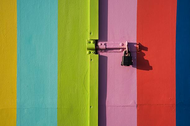 istock Rainbow-coloured painted Beach Hut door 2239224466