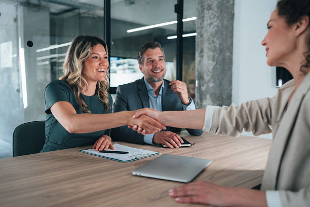 istock Meeting success. Business partners shaking hands 2239225801