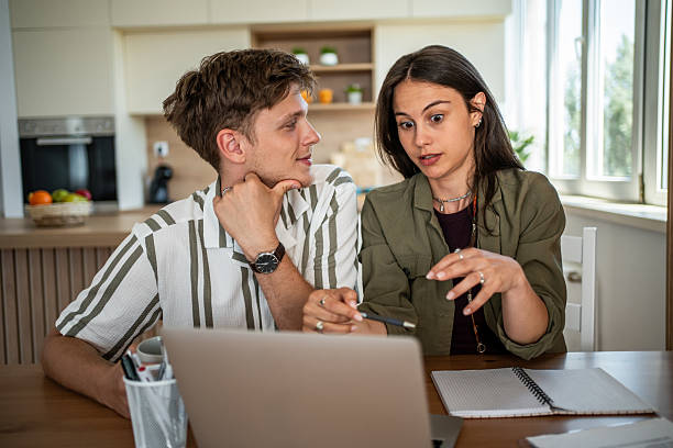 istock Young couple planning home budget with laptop 2239228908