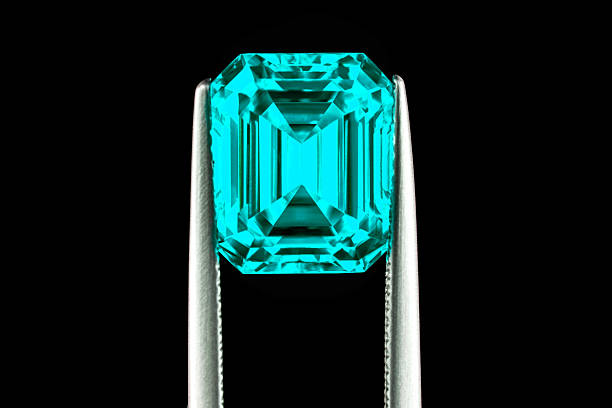 istock A blue gemstone is being held up by a metal tool 2239229196