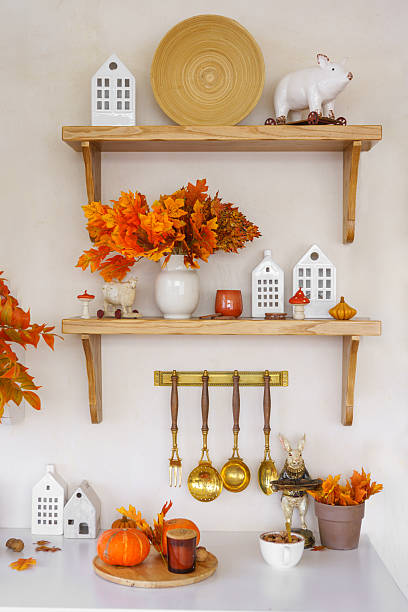 istock Kitchen autumn decor with pumpkins, kitchen utensils, and vibrant foliage in bright space 2239233446