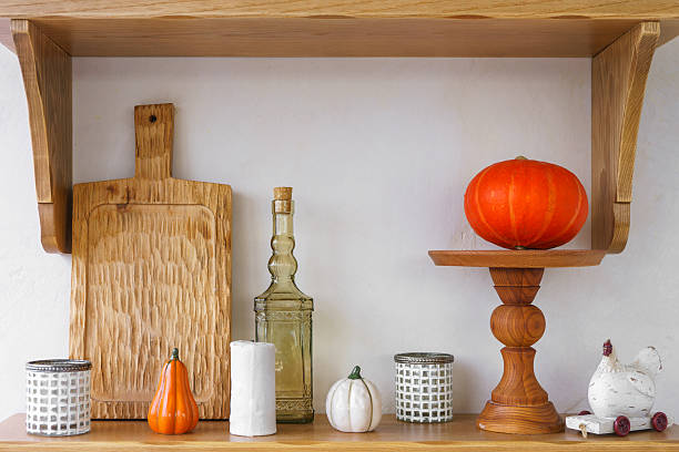istock Kitchen autumn decor with pumpkins, kitchen utensils, and vibrant foliage in bright space 2239233462