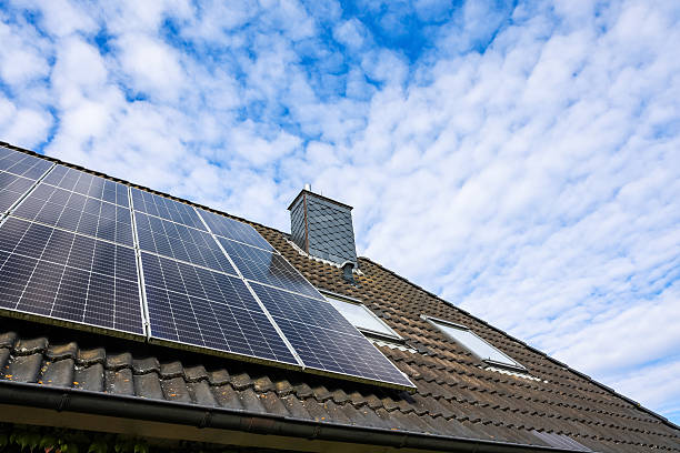 istock Solar panels generating clean energy on residential roof 2239235819