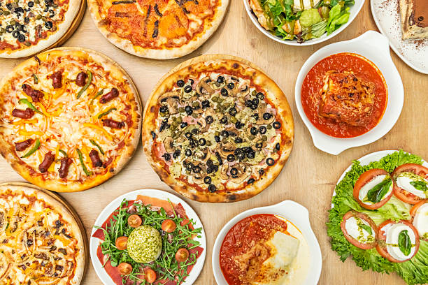 istock A table full of various pizzas and typical Italian dishes 2239245156