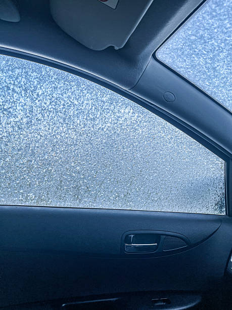 istock Frozen Car Interior Viewed from Passenger Side. Iced car's glass. 2239245899