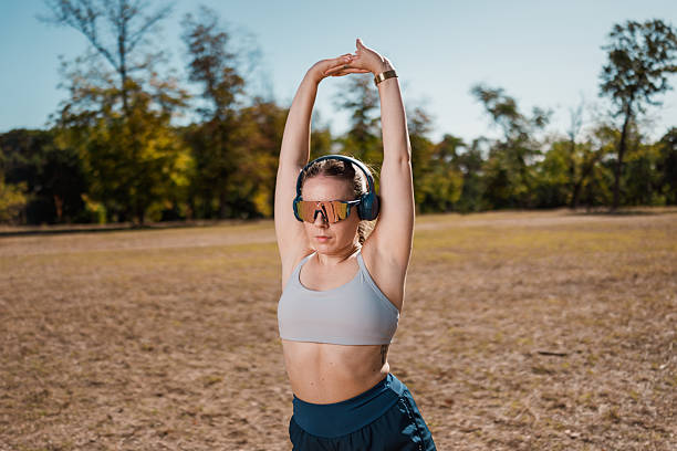 istock Female Athlete Warming Up In Nature 2239247559