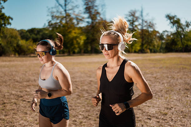 istock Two Athletic Women Training In Open Field 2239248849