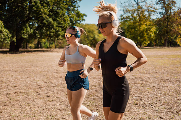 istock Friends Running Together In Nature 2239249683