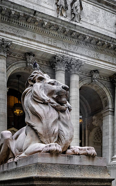 istock Stone lion statue outside New York Public Library in Manhattan 2239252984