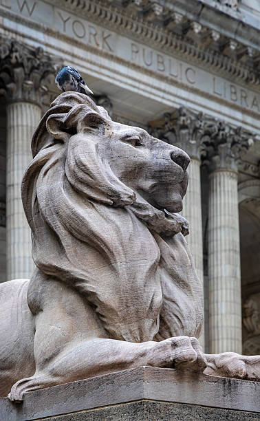 istock Stone lion statue outside New York Public Library in Manhattan 2239253075
