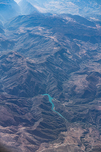 High angle view of lakes and hill range of Liberty County. Summer afternoon with drifting wildfire smoke.