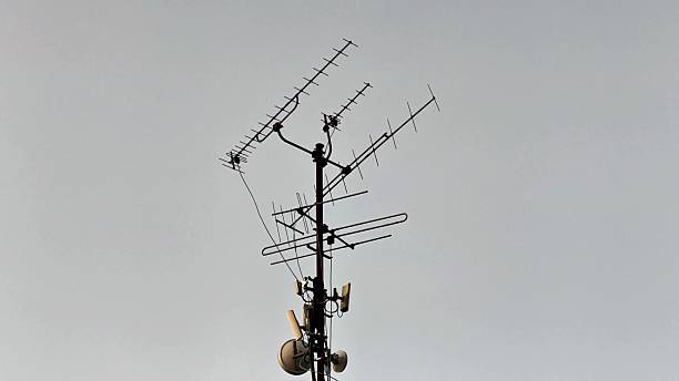 istock A diverse antenna array mounted on a communication tower stands prominently against a gray sky 2239255578