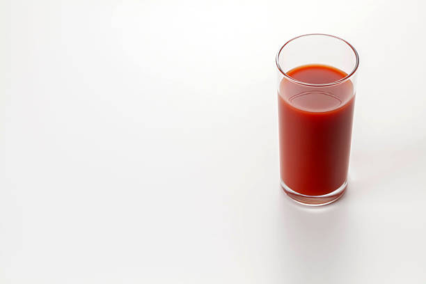 Delicious tomato juice on a white background