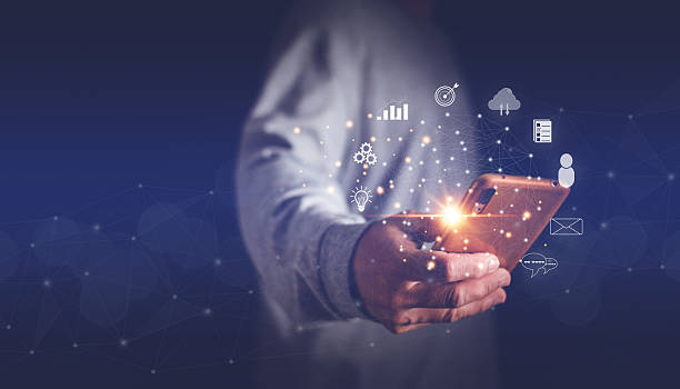 istock Businessman holding smartphone to connection global network, Big data analytics and business intelligence concept, Internet of Things (IoT), Futuristic communication wireless technology, Digital link. 2239258259