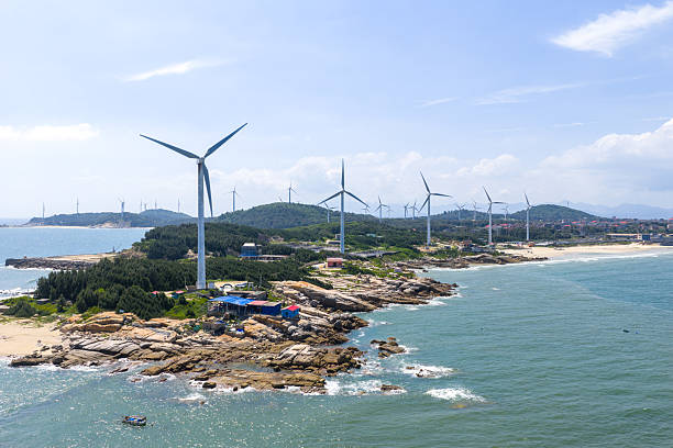 istock Layers of waves along the coast, beach, wind turbines 2239260045