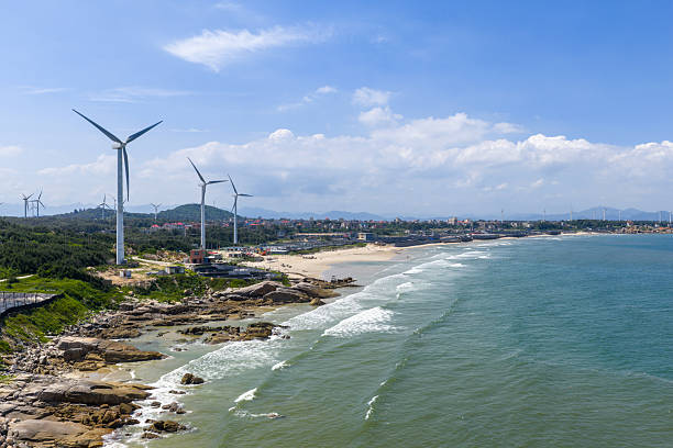 istock Layers of waves along the coast, beach, wind turbines 2239260065