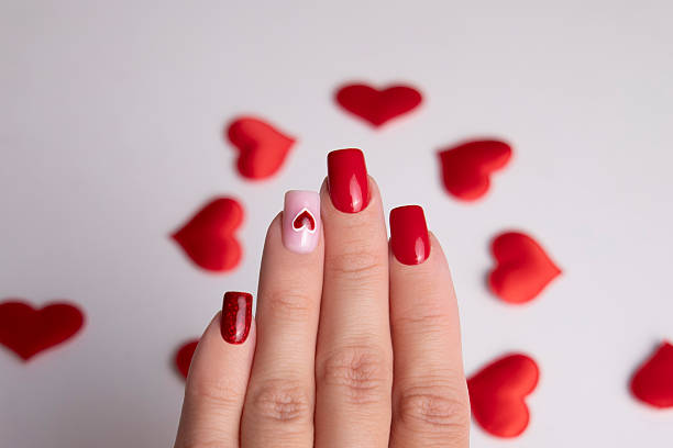 istock Female hands with red manicure nails 2239262183