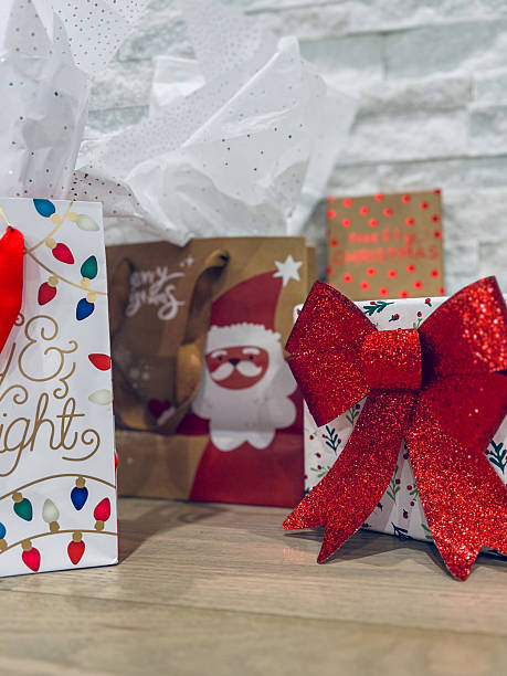 istock Christmas presents wrapped in a big red bow 2239263621