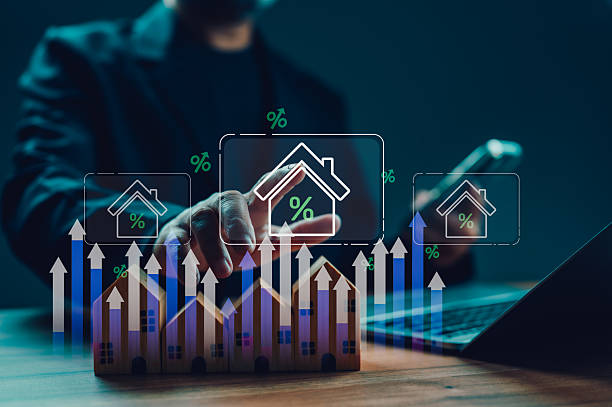 istock Businessman analyzes real estate market trends using futuristic interface. Hand touches virtual screen showing property investment growth, interest rate percentages, mortgage analytics, financial 2239265992
