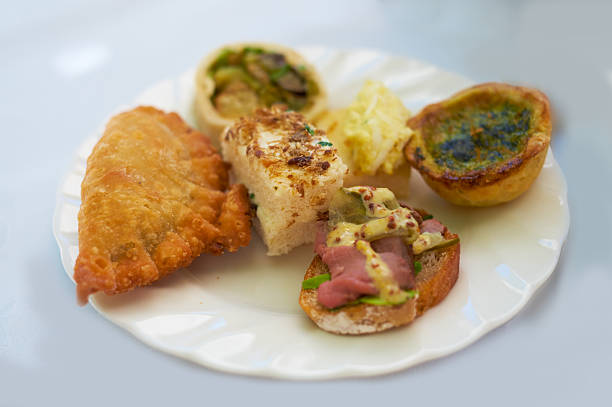 Appetizing small dishes including baked, fried, and toasted elements arranged on a single platter. Perfectly captures the vibrant presentation and luxurious feel of gourmet cuisine, ideal for culinary visual representation.