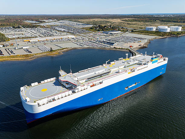 Charleston, SC, USA - December 08, 2023: Donington, a 200-meter roll-on roll-off vehicles flagged to Liberia, passes Sullivan’s Island as it sails into Charleston Harbor.