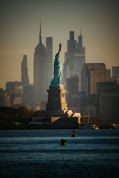 New York City's skyline from Northern New Jersey. The Empire State Building and Statue of Liberty can be seen.