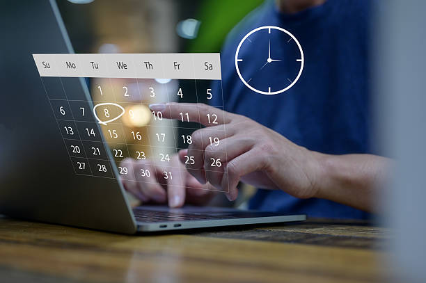 istock Person using laptop with digital calendar and clock interface for scheduling and time management symbolizing online scheduling, time management, productivity, planning, and digital organization 2239276752