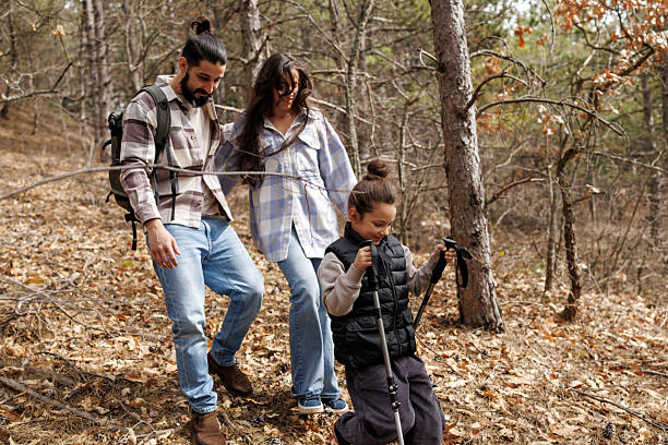 istock Family on hiking adventure in pine forest 2239280084